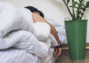 Sleep Hygiene - woman in white robe sitting on chair