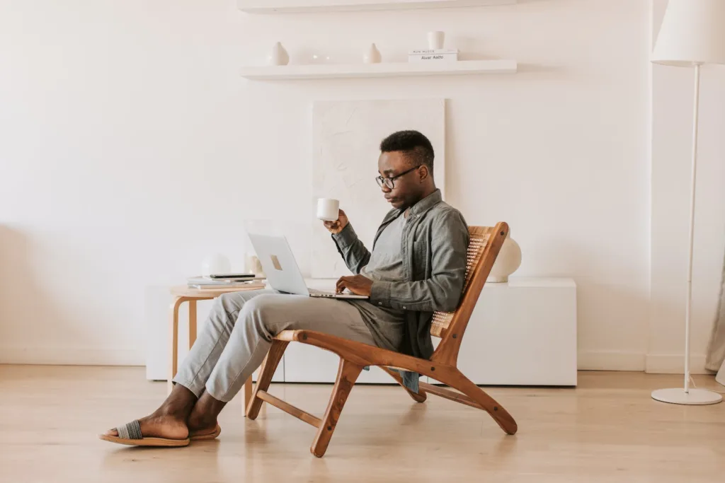 Financial Freedom - Man Sitting With a Laptop on his Lap