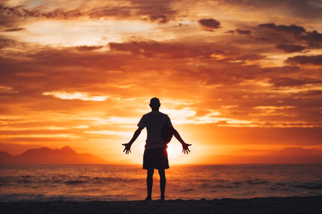 Gratitude - silhouette of man running on beach during sunset