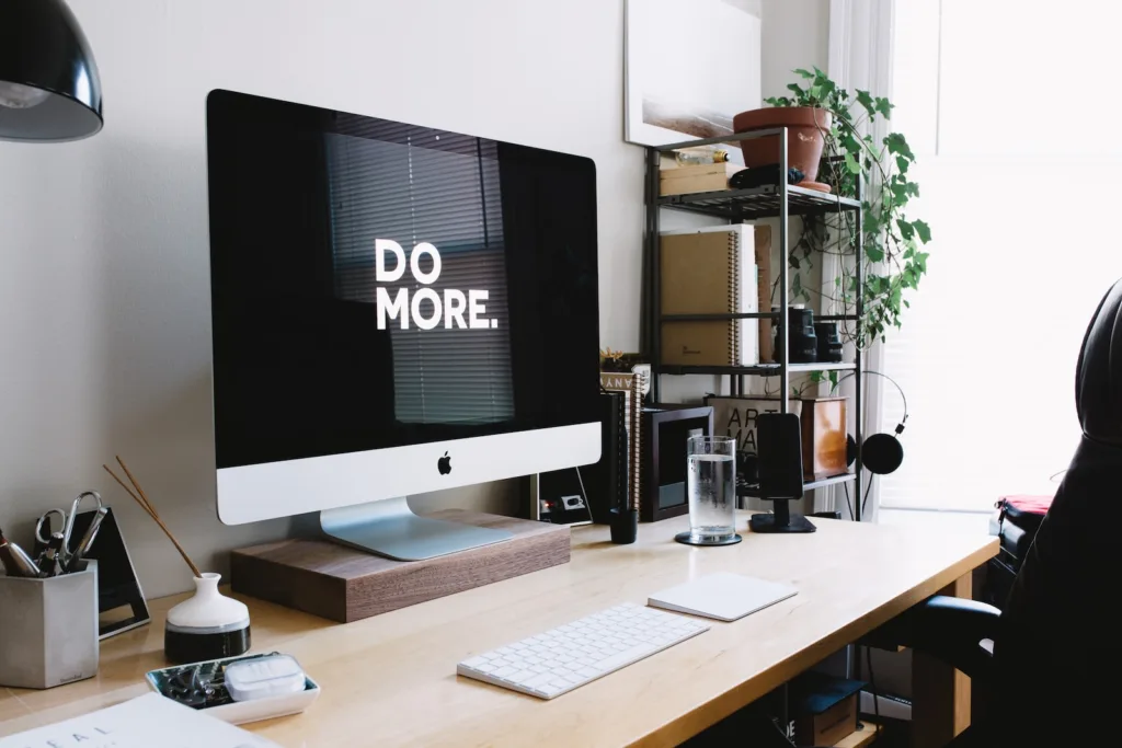 Passive Income - silver iMac with keyboard and trackpad inside room