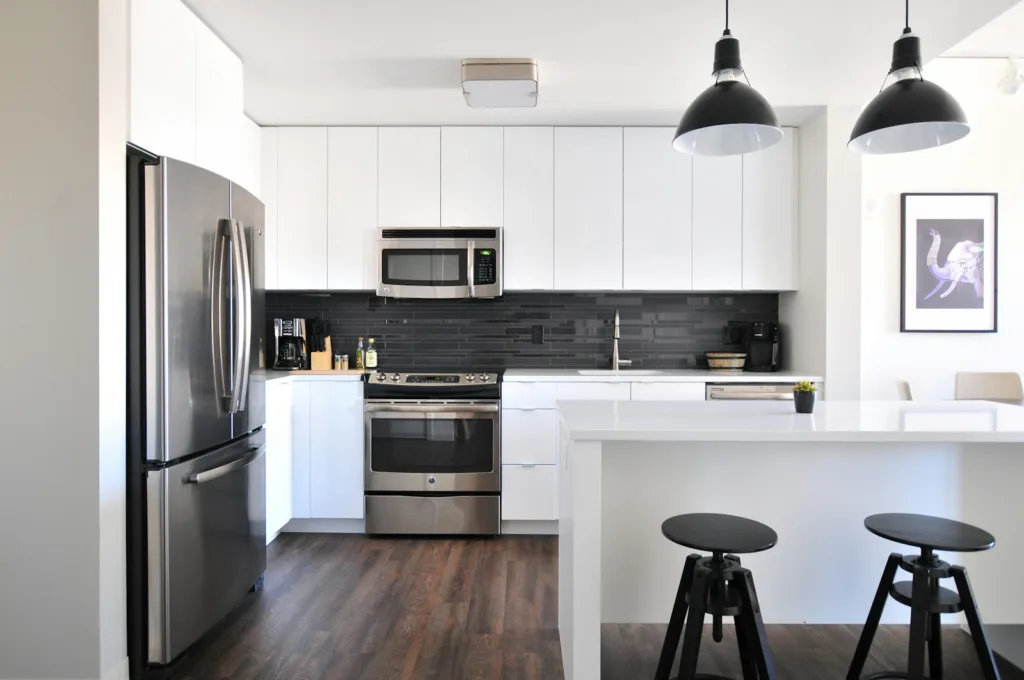 Renting vs Buying a Home - gray steel 3-door refrigerator near modular kitchen